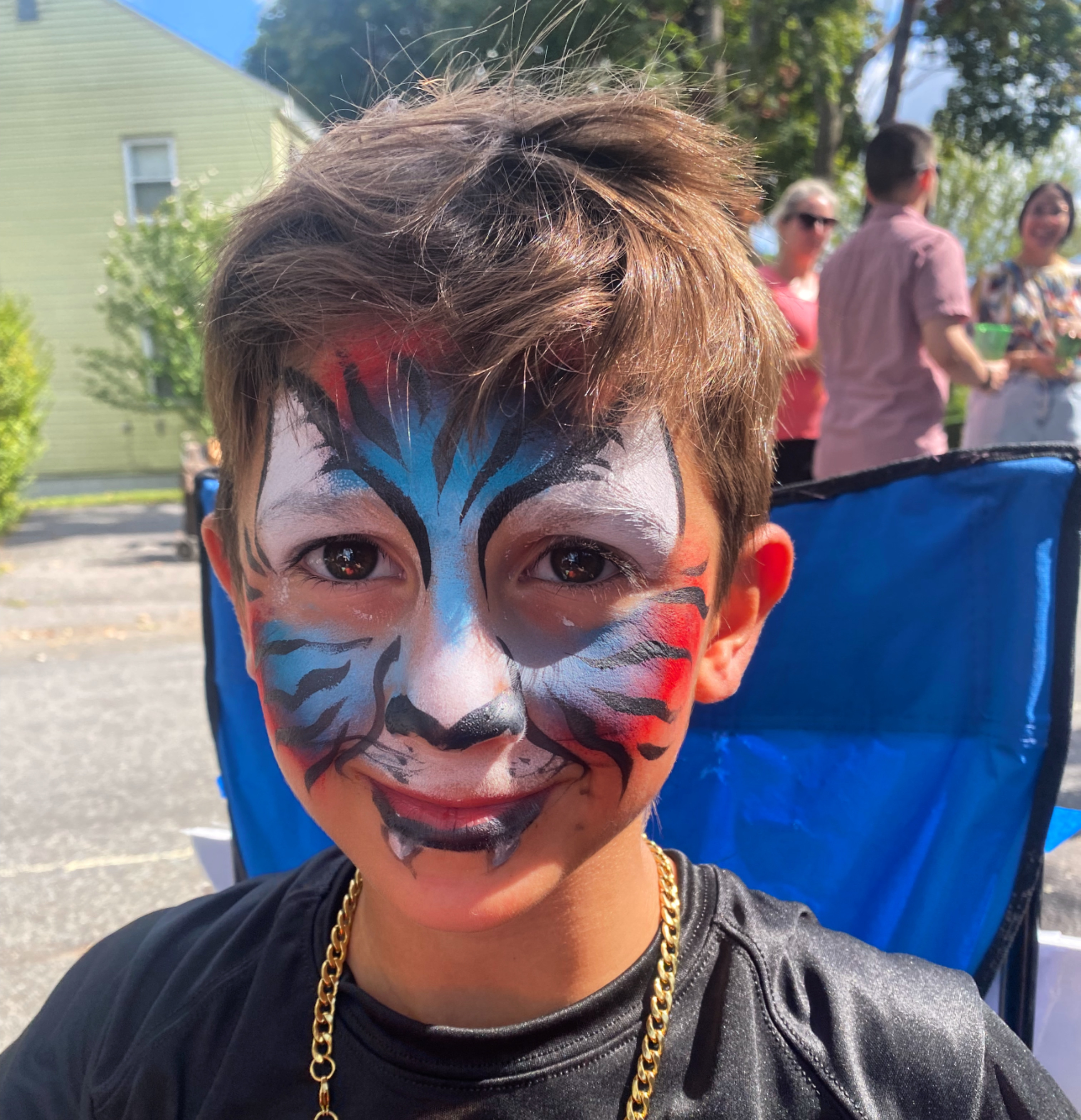 Face painting by Sparkle Motion